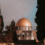 A serene view of the Dome of the Rock, Jerusalem at sunset, reflecting historical Islamic architecture.