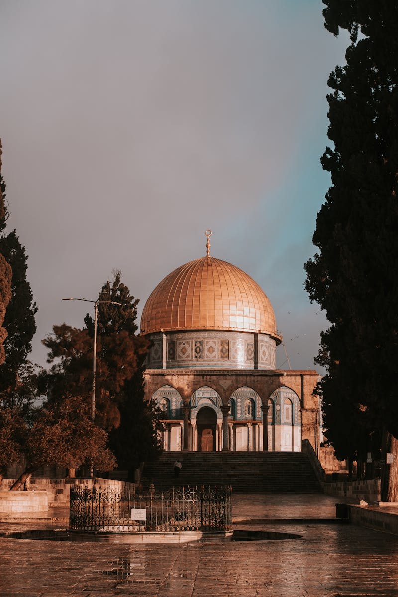 A serene view of the Dome of the Rock, Jerusalem at sunset, reflecting historical Islamic architecture.